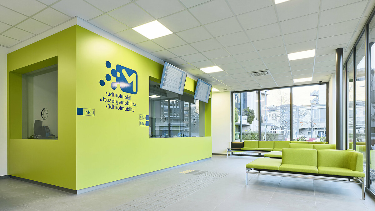 Waiting area and counters inside the Infopoint in Bolzano/Bozen.