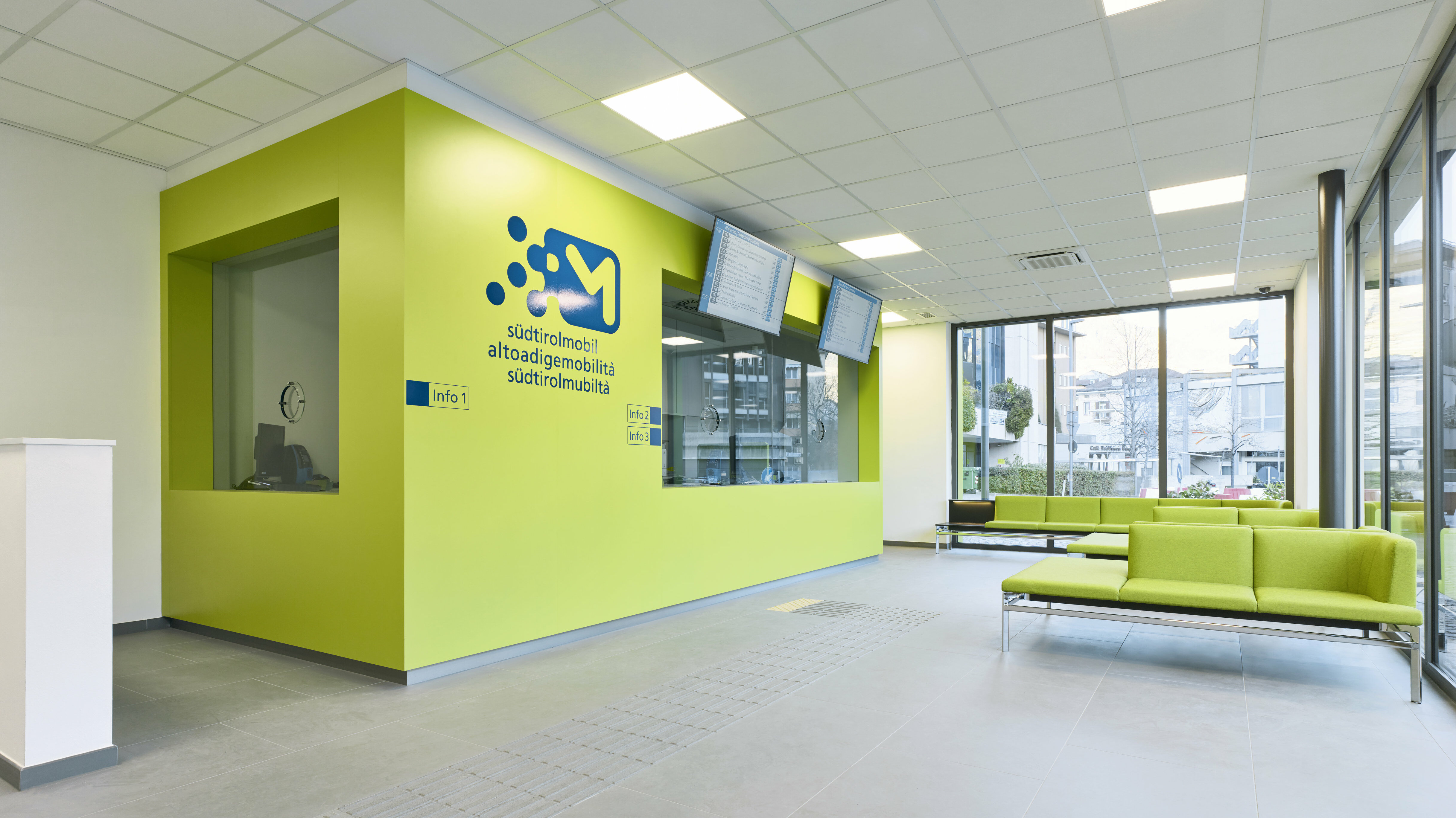 Waiting area and counters inside the Infopoint in Bolzano/Bozen.