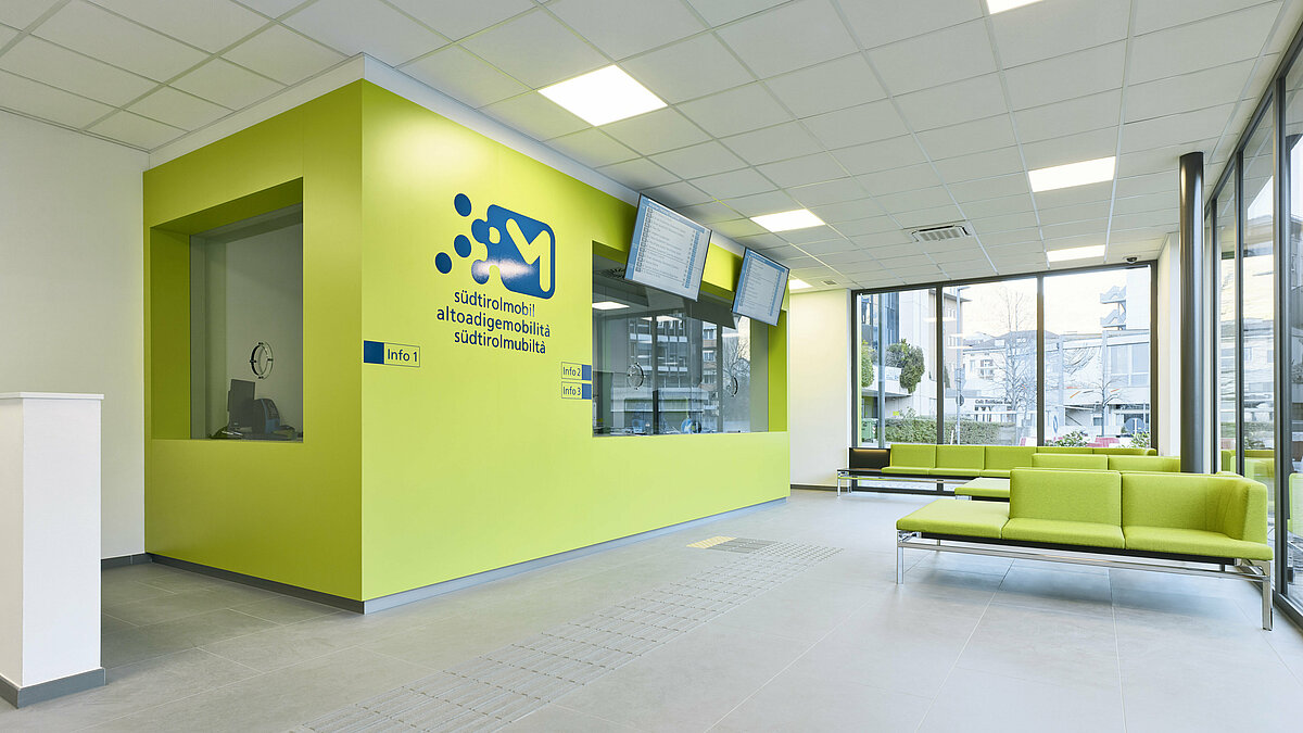 Waiting area and counters inside the Infopoint in Bolzano/Bozen.