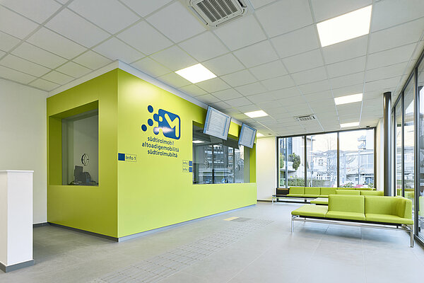 Waiting area and counters inside the Infopoint in Bolzano/Bozen.