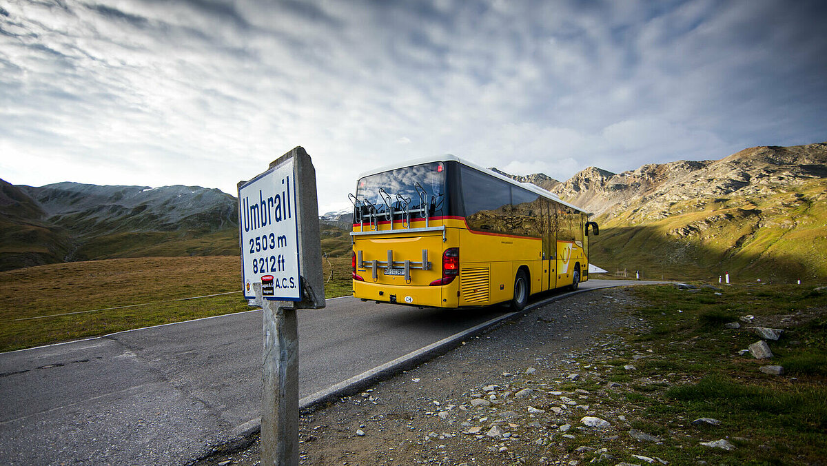 PostAuto bus on a mountain street